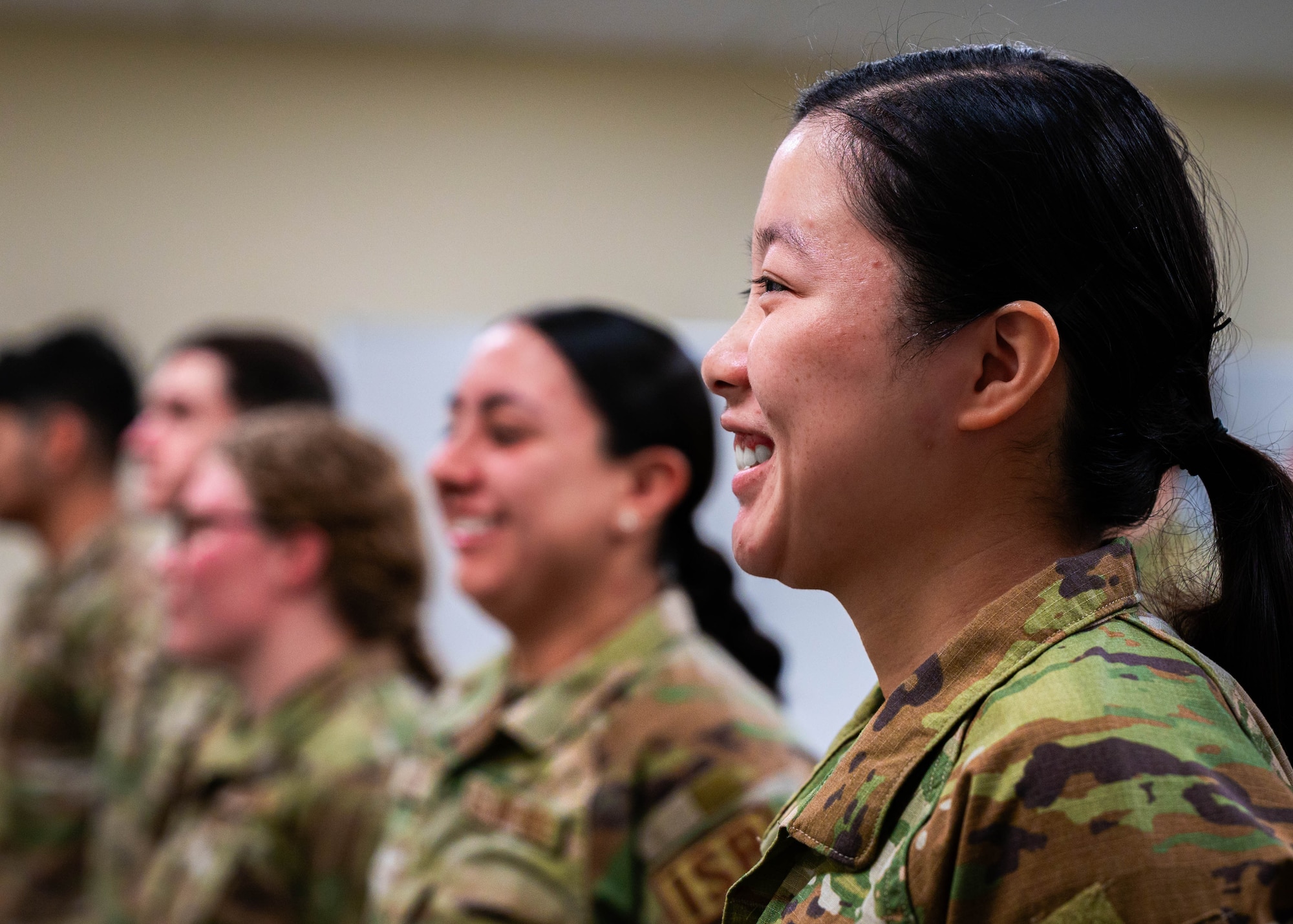 U.S. Air Force Capt. Catherine Tighe, a student in the F-16 Fighting Falcon Intelligence Formal Training Unit, stands with her peers in the facility’s classroom.