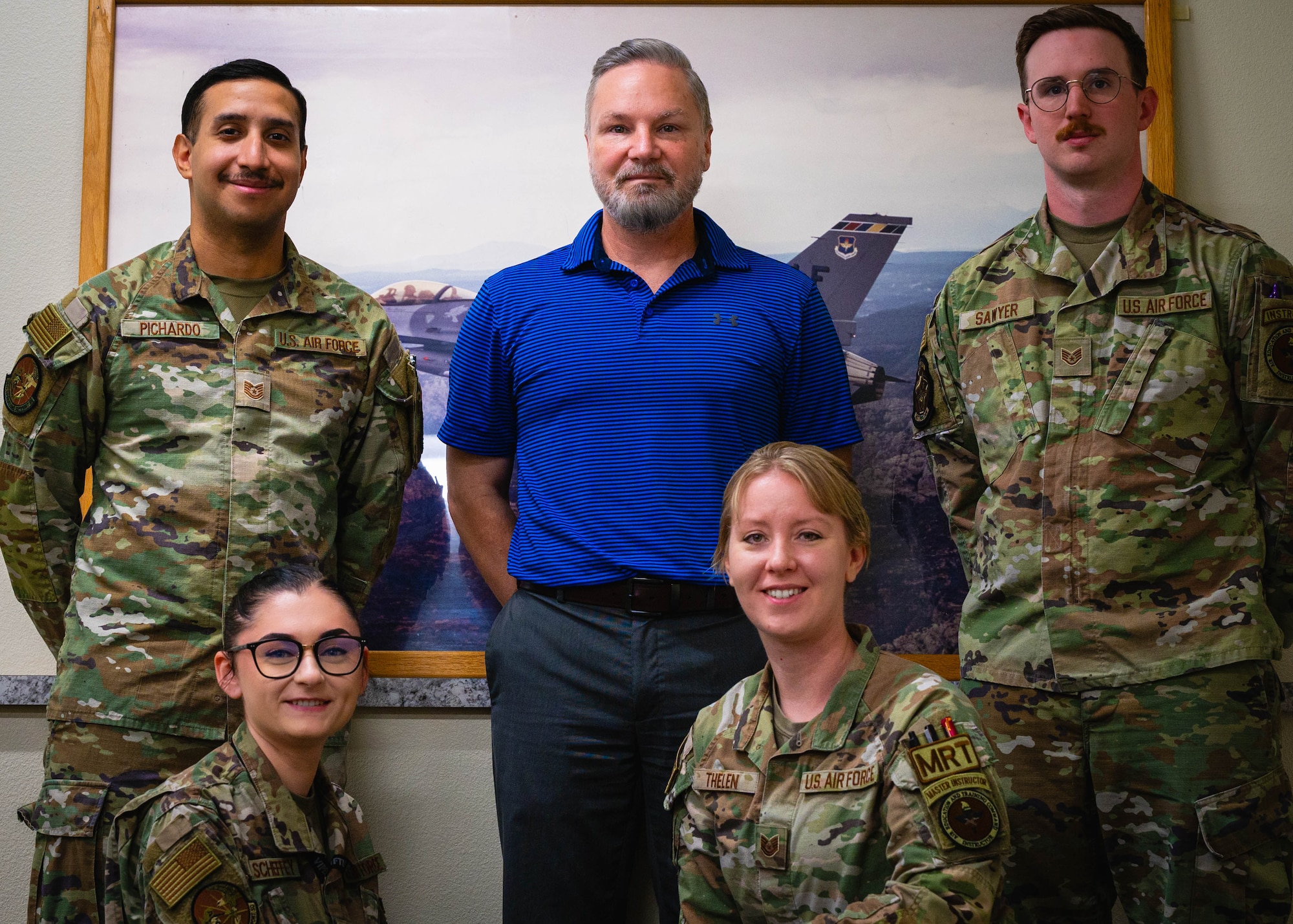 U.S. Air Force instructor cadre assigned to the 56th Operations Support Squadron, pose for a picture with Ed Rutkowski, F-16 Fighting Falcon Intelligence Formal Training Unit course director.