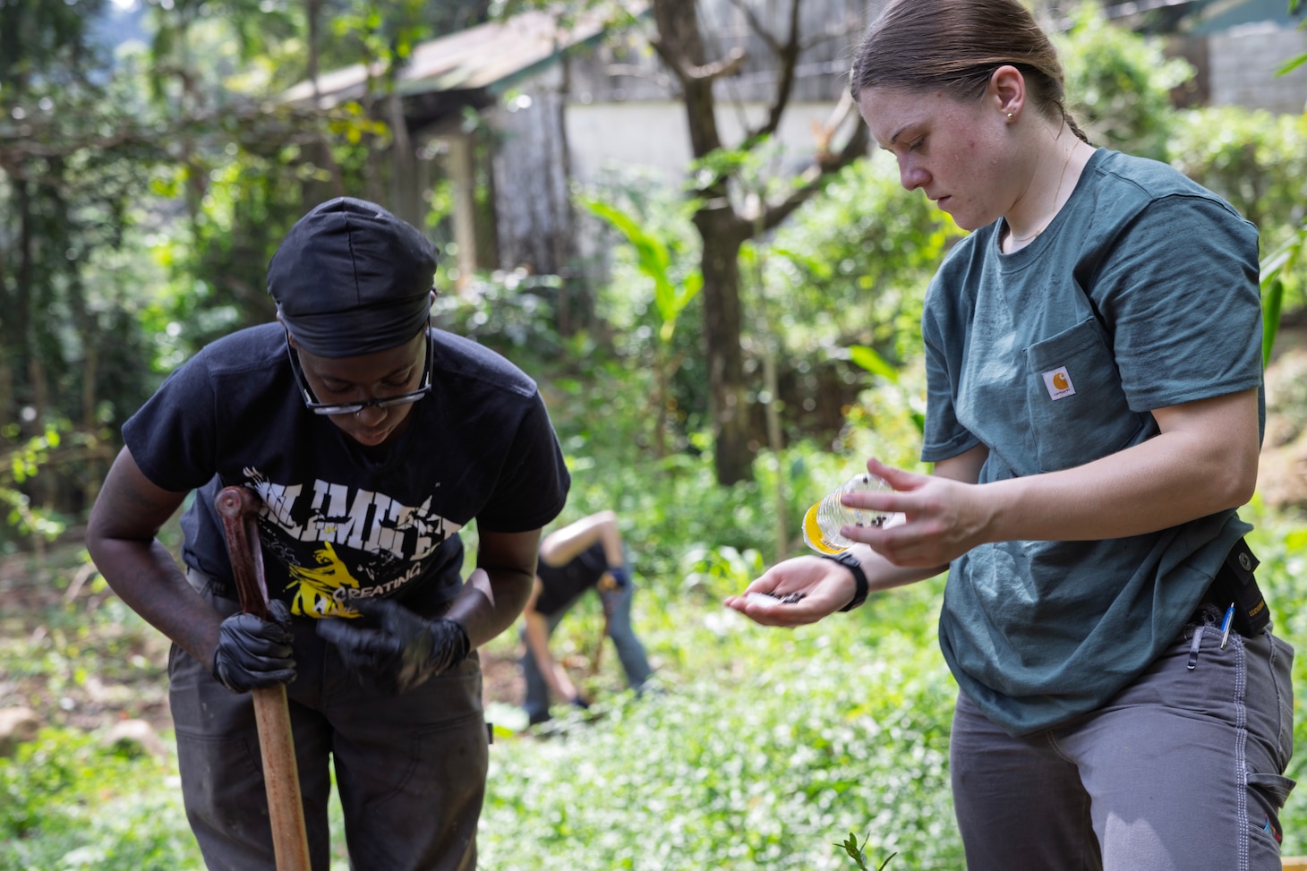 SUBIC, Philippines (Dec. 4, 2024) —Civilian mariner Azhatia McFarland, left, ordinary seaman, and deck cadet Alexa Tipps, both with Military Sealift Command’s (MSC) dry cargo and ammunition ship USNS Charles Drew (T-AKE 10), prepare to plant seeds in a vegetable garden at Aningway-Sacatihan Elementary School Annex/High School during a community outreach event at Subic, Philippines, Dec. 4, 2024. The Aeta are indigenous people who live in scattered, isolated mountainous parts of Luzon, Philippines. MSC Far East supports the U.S. 7th Fleet and ensures approximately 50 ships in the Indo-Pacific Region are manned, trained, and equipped to deliver essential supplies, fuel, cargo, and equipment to warfighters, both at sea and on shore. (U.S. Navy photo by Grady T. Fontana)