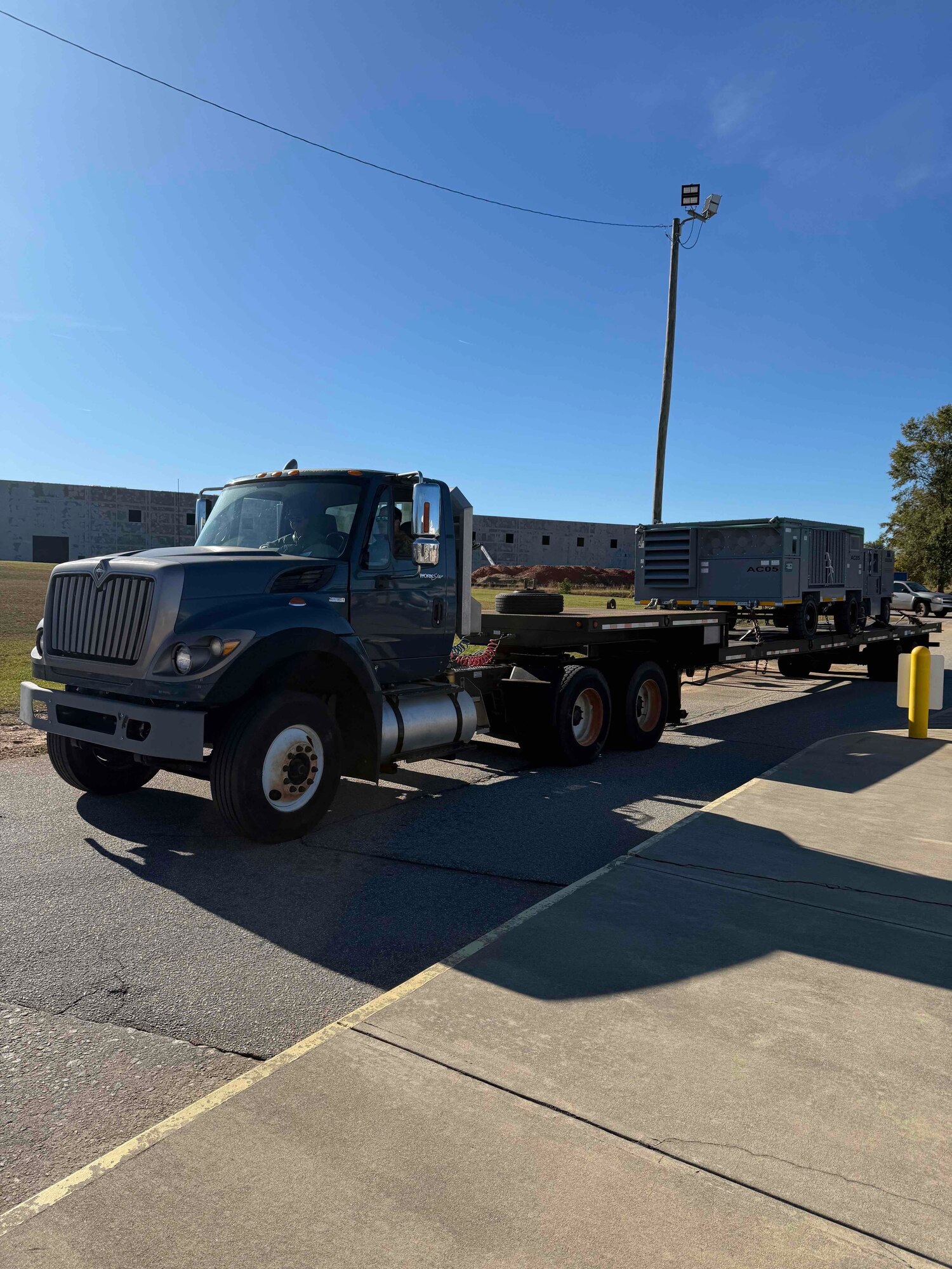 Two Alabama Air National Guard Airmen deliver equipment to repair an F-35A Lightning II in Greenville, South Carolina, Nov. 23, 2024. The Airmen delivered the necessary equipment after the aircraft encountered a mechanical issue after landing. (Courtesy Photo)