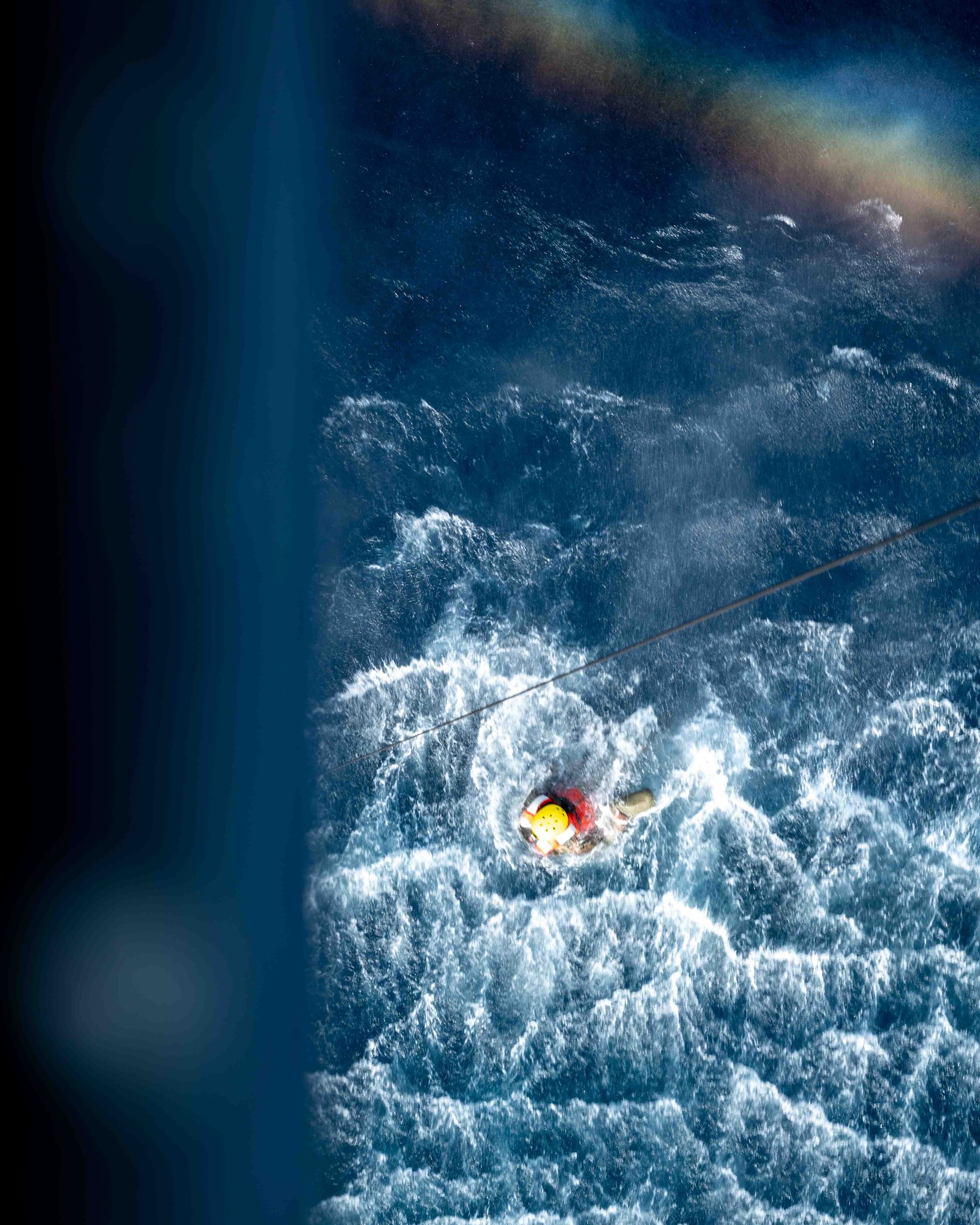service member swimming in the water.