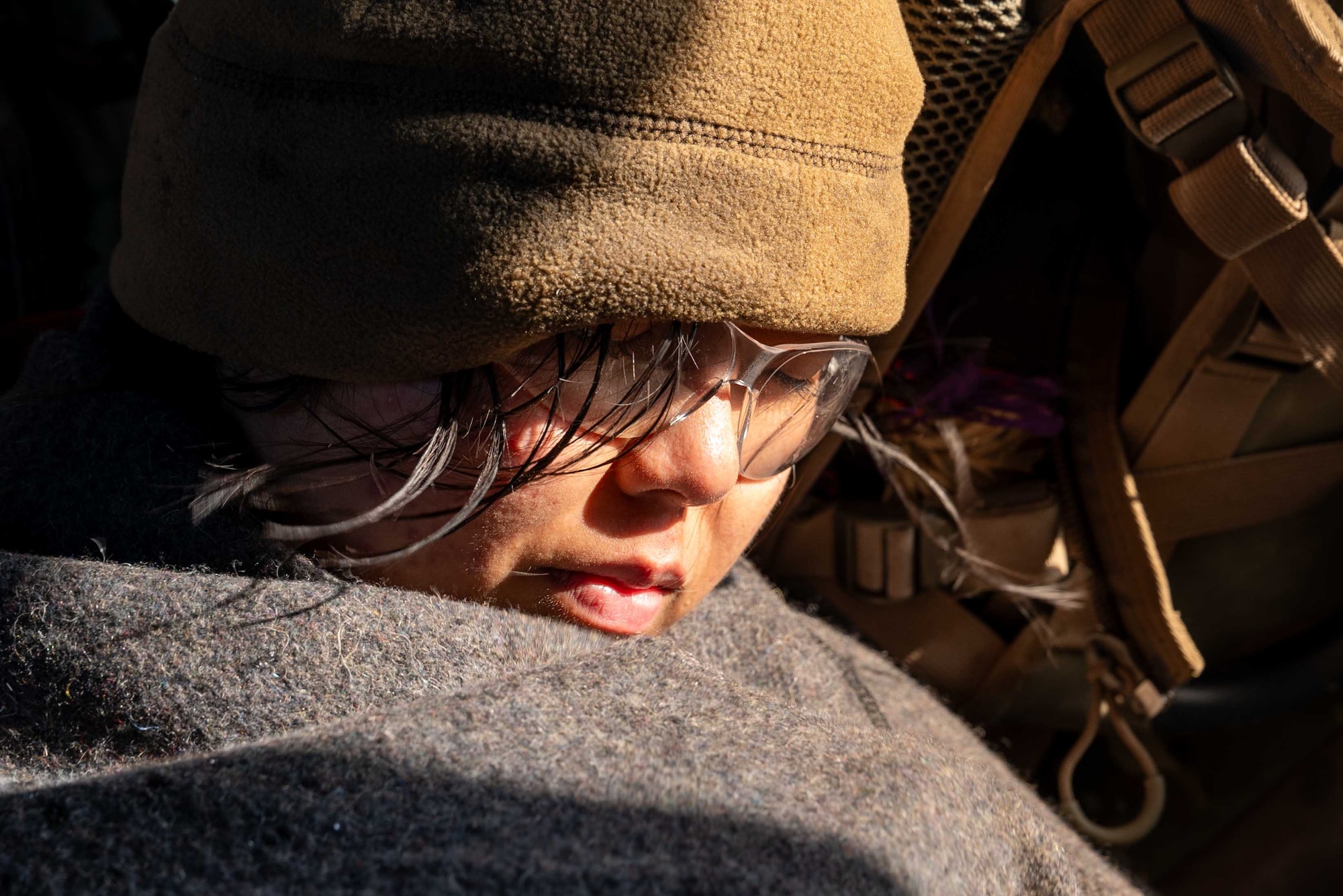 Service member falls asleep in a blanket