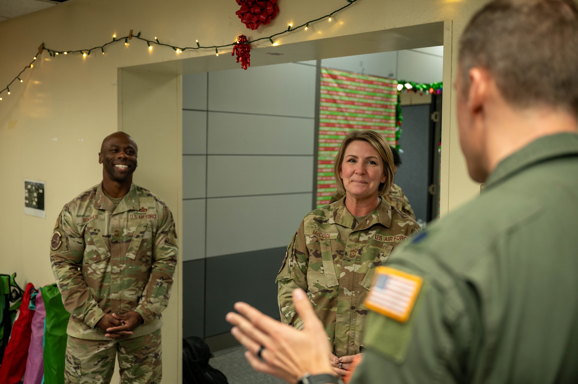 Service members speak with each other.