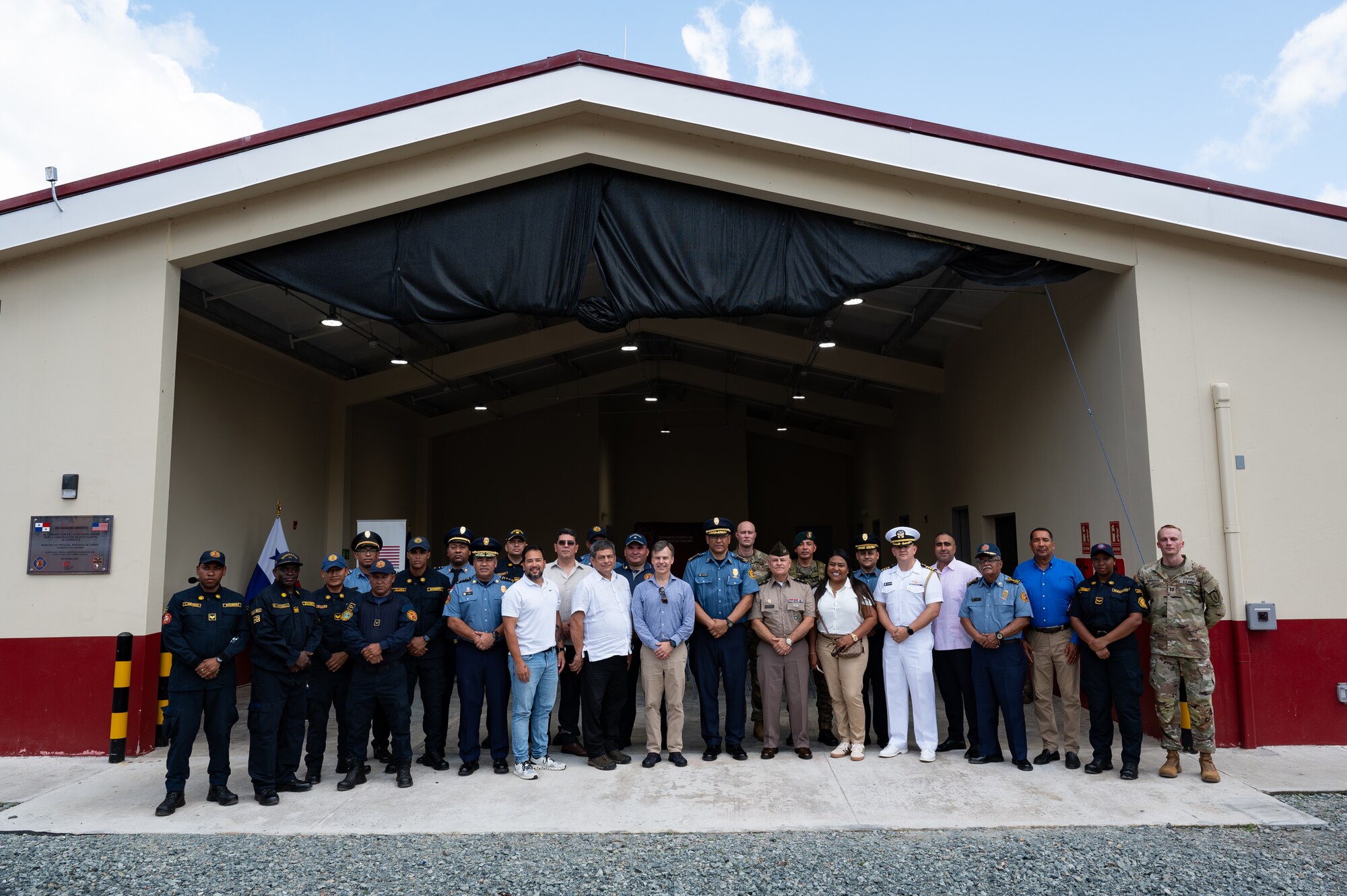 Firehouse donation ceremony attendees pose for a group photo after the ceremony in Yaviza, Panama, Dec. 10, 2024.