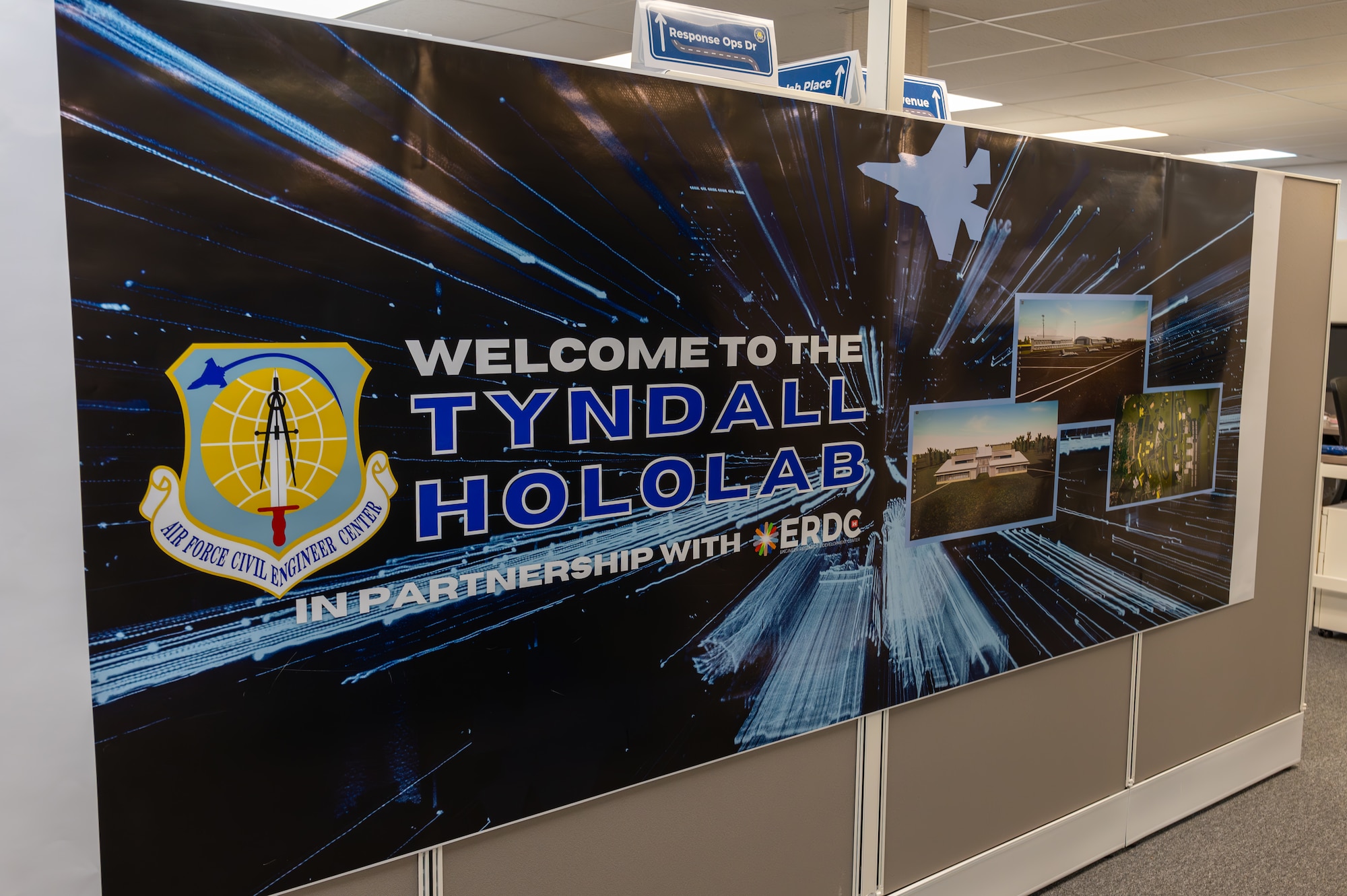 A Tyndall Hololab banner hangs in the Natural Disaster Recovery Division office