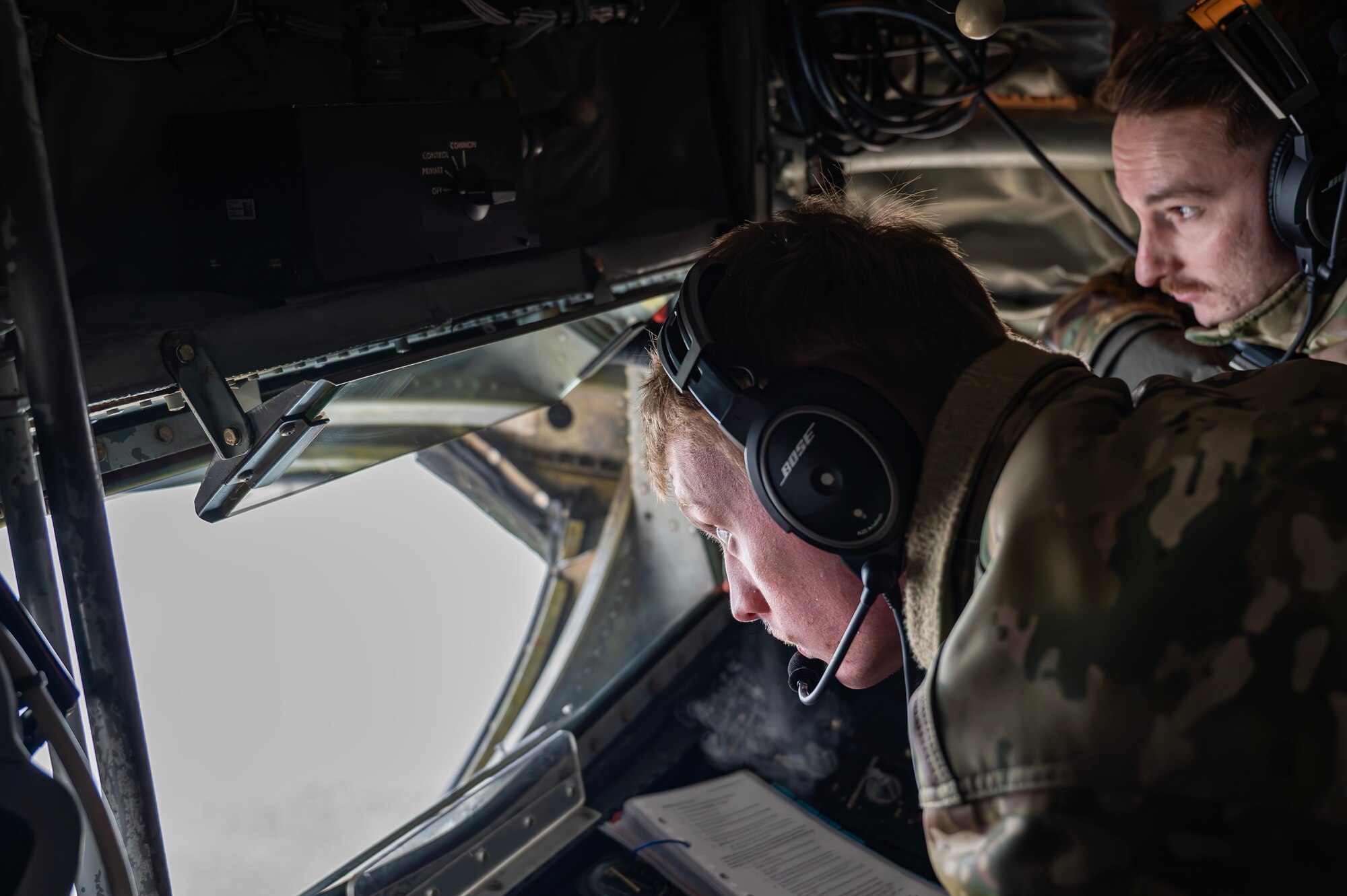 Airmen in a boom pod