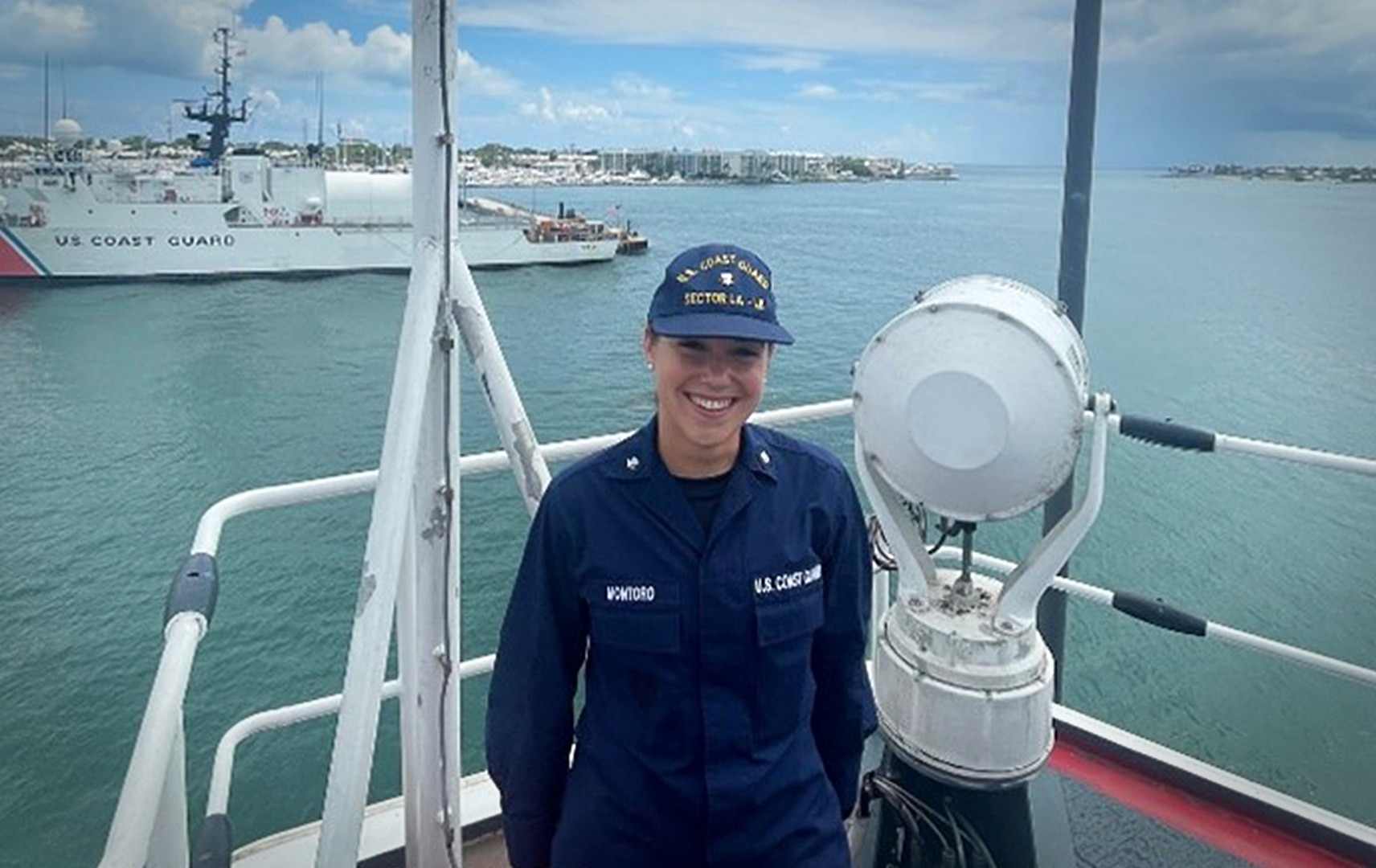 Petty Officer Third Class Elizabeth Montoro poses aboard a 270-foot Medium Endurance Cutter (MEC) while serving as Situation Unit Leader during Operation Vigilant Sentry (OVS) (U.S. Coast Guard photo courtesy of Petty Officer Third Class Elizabeth Montoro).