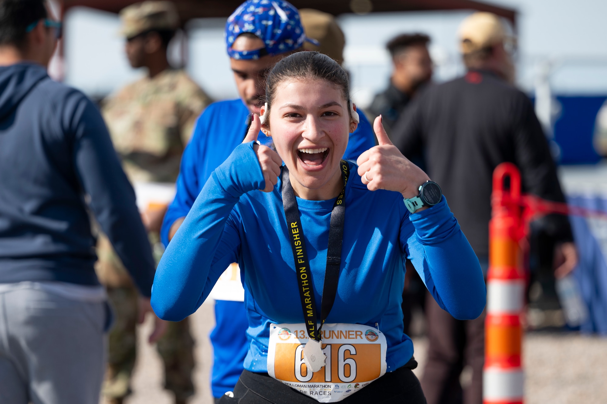U.S. Air Force 2nd Lt. Emerald Cray, 49th Comptroller Squadron financial analysis flight commander, celebrates after completing the half marathon event in the 2nd annual Ace of Races Marathon at Holloman Air Force Base, New Mexico, Dec. 7, 2024.