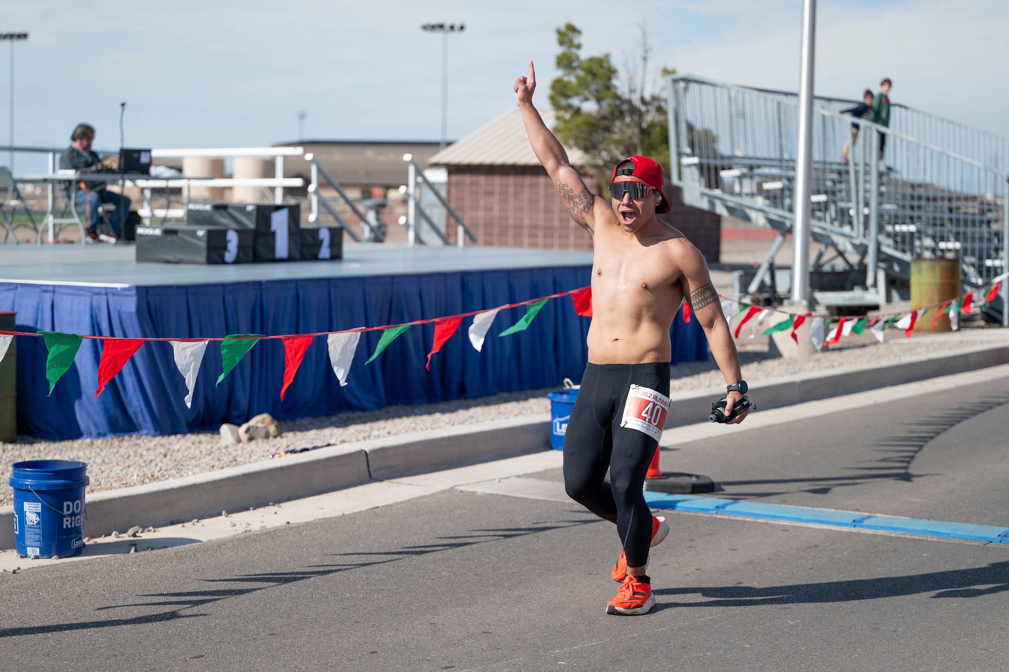 U.S. Air Force Senior Airman Reubhen Delfin of the 9th Special Operations Aircraft Maintenance Squadron at Cannon Air Force Base, New Mexico, celebrates winning 1st place in the 2nd annual Ace of Races Marathon at Holloman AFB, New Mexico, Dec. 7, 2024.