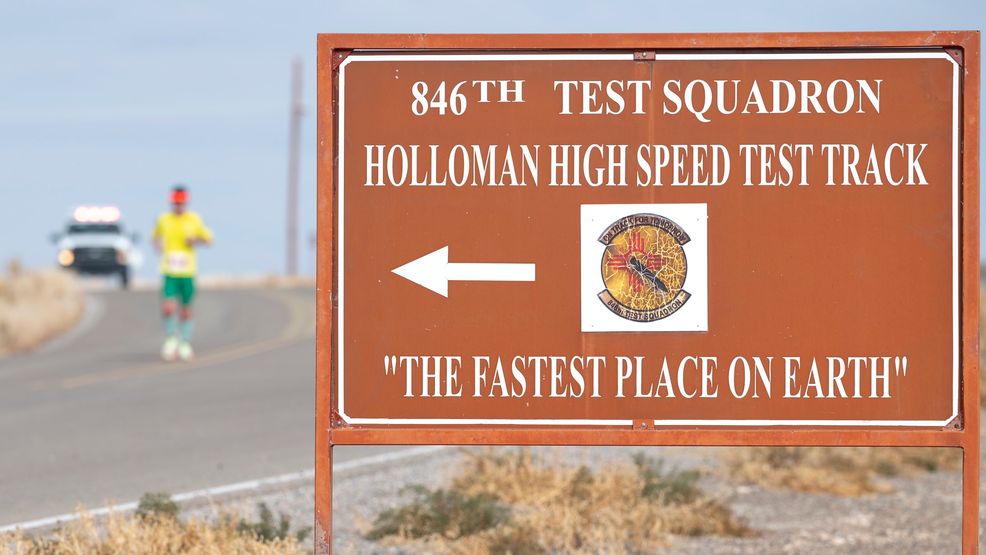 A runner passes the Holloman High-Speed Test Track during the 2nd annual Ace of Races Marathon at Holloman Air Force Base, New Mexico, Dec. 7, 2024.