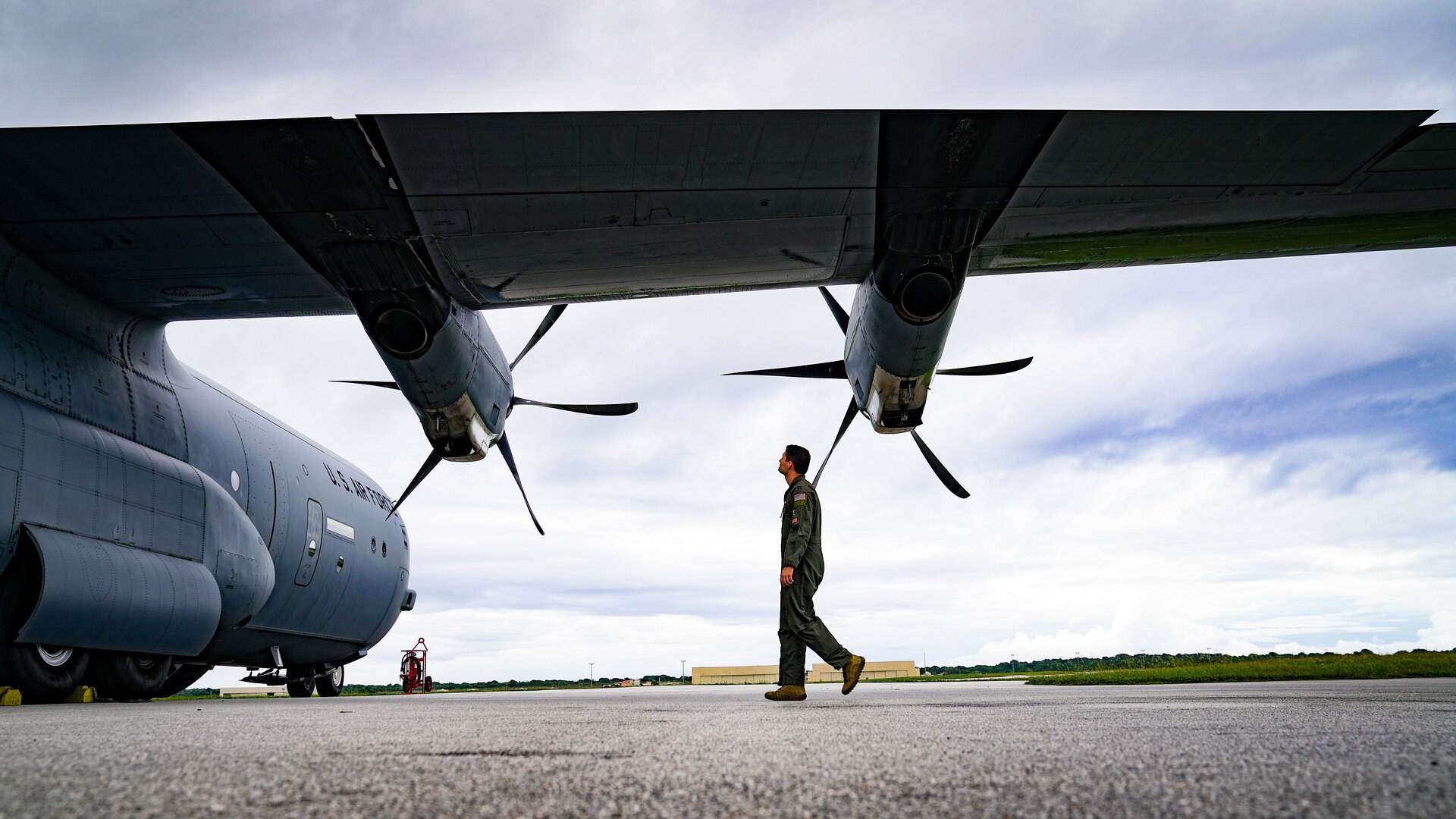 USAF Captain walks by an aircraft when conducting a post flight inspection during Operation Christmas Drop