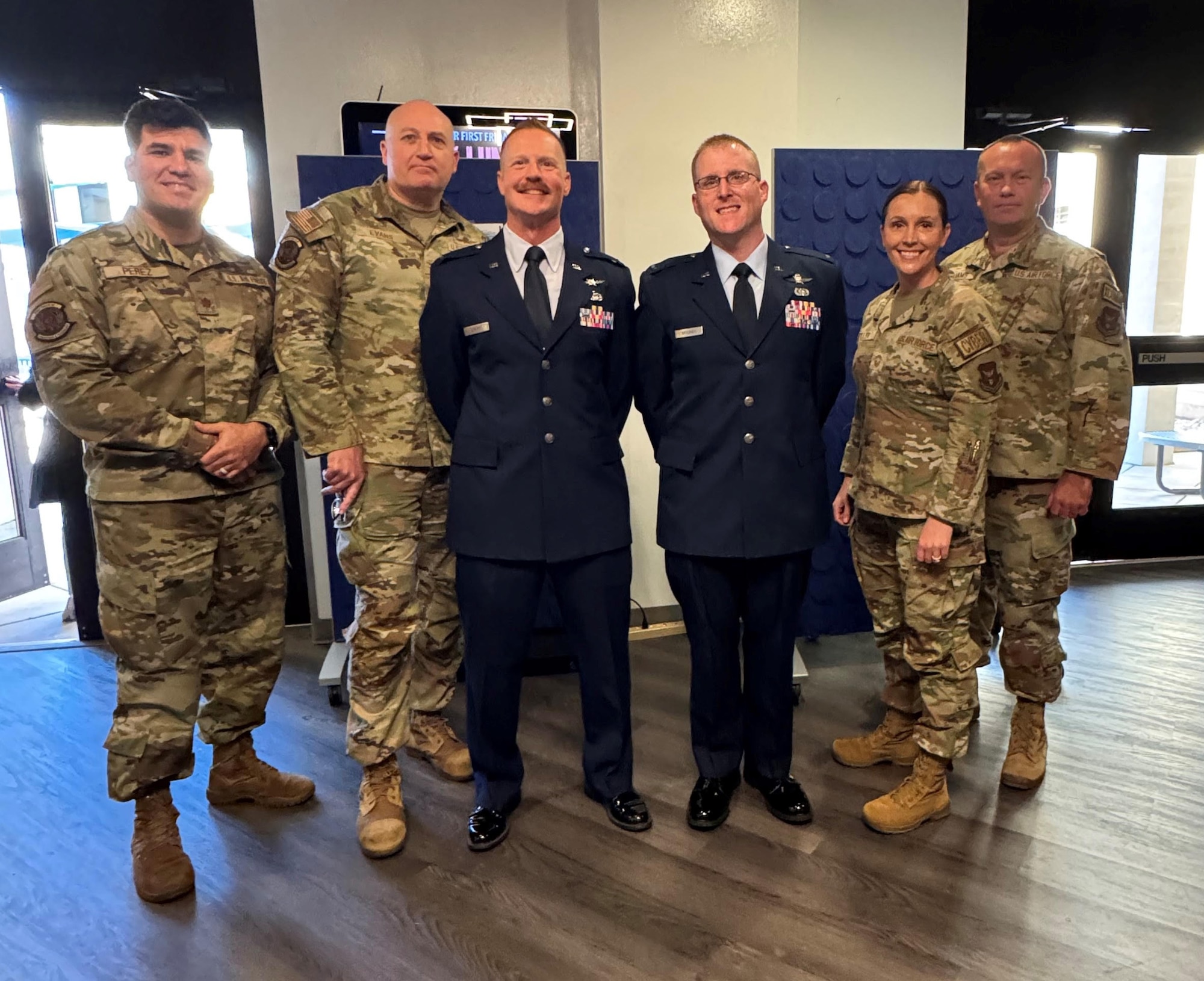 Members of the Reserve Warrant Officer Selection Board gather around Air Force Reserve Command’s two warrant officers, Chief Warrant Officer 2nd Class John Brasher and Chief Warrant Officer 2nd Class Jeremy Smart, for a photo following the inaugural Warrant Officer Training School graduation on Dec. 6 (U.S. Air Force photo by Maj. Marcie Mascaro)