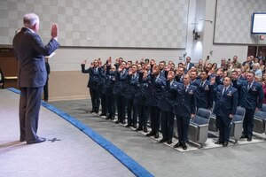 Secretary of the Air Force Frank Kendall issues the oath of office to new Air Force Warrant Officer Training School students after their graduation ceremony at Maxwell Air Force Base, Alabama, Dec. 6, 2024. The ceremony marked a historic milestone for the Air Force with the reintroduction of the Warrant Officer Corps in its inaugural class, consisting of 30 total candidates, 22 Active Duty, six Guardsmen and two Reservists. (U.S. Air Force photo by Trey Ward)