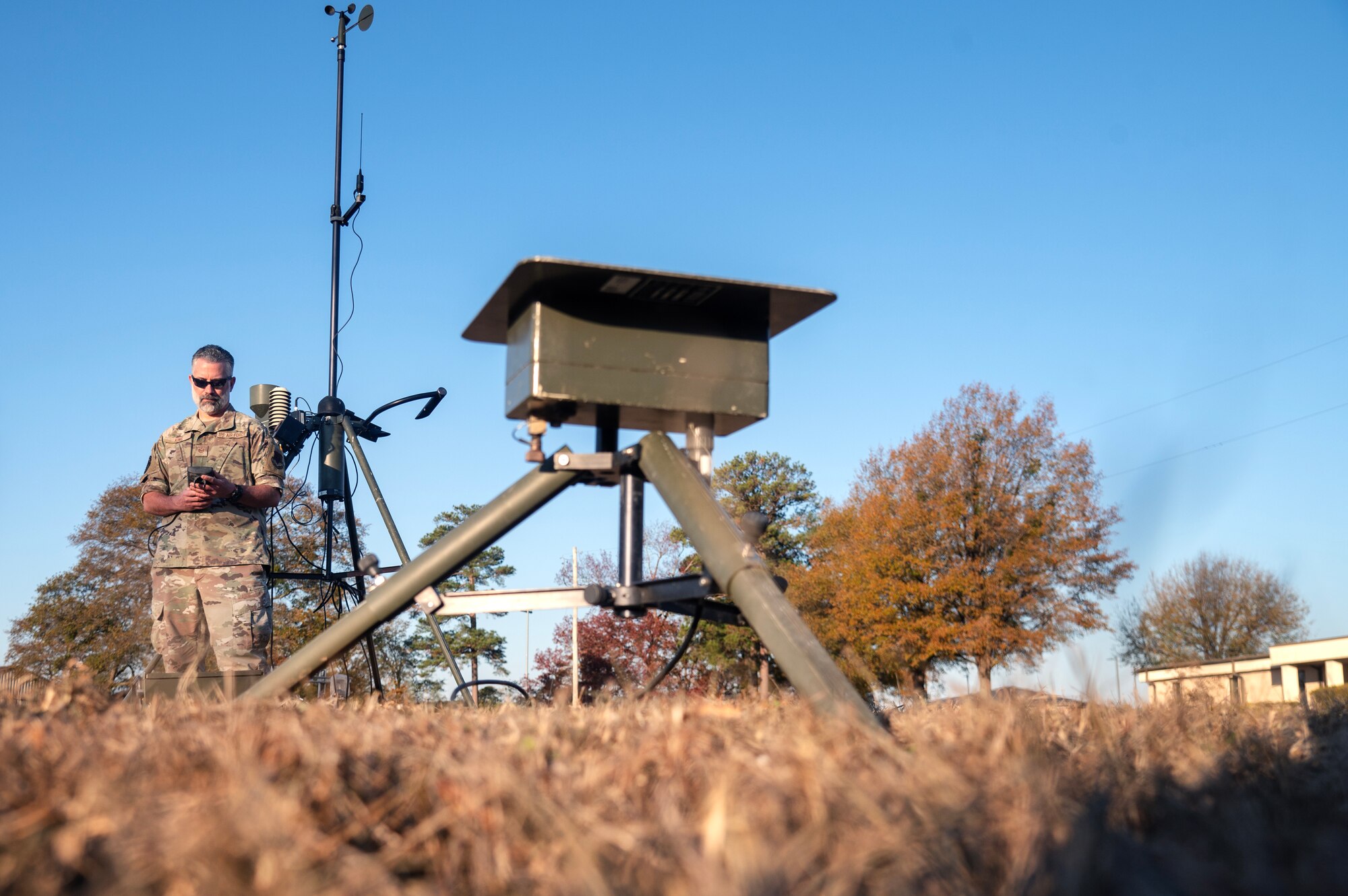 Tech. Sgt. James King, 4th Operations Support Squadron weather forecaster, performs an operations check on a tactical weather sensor.