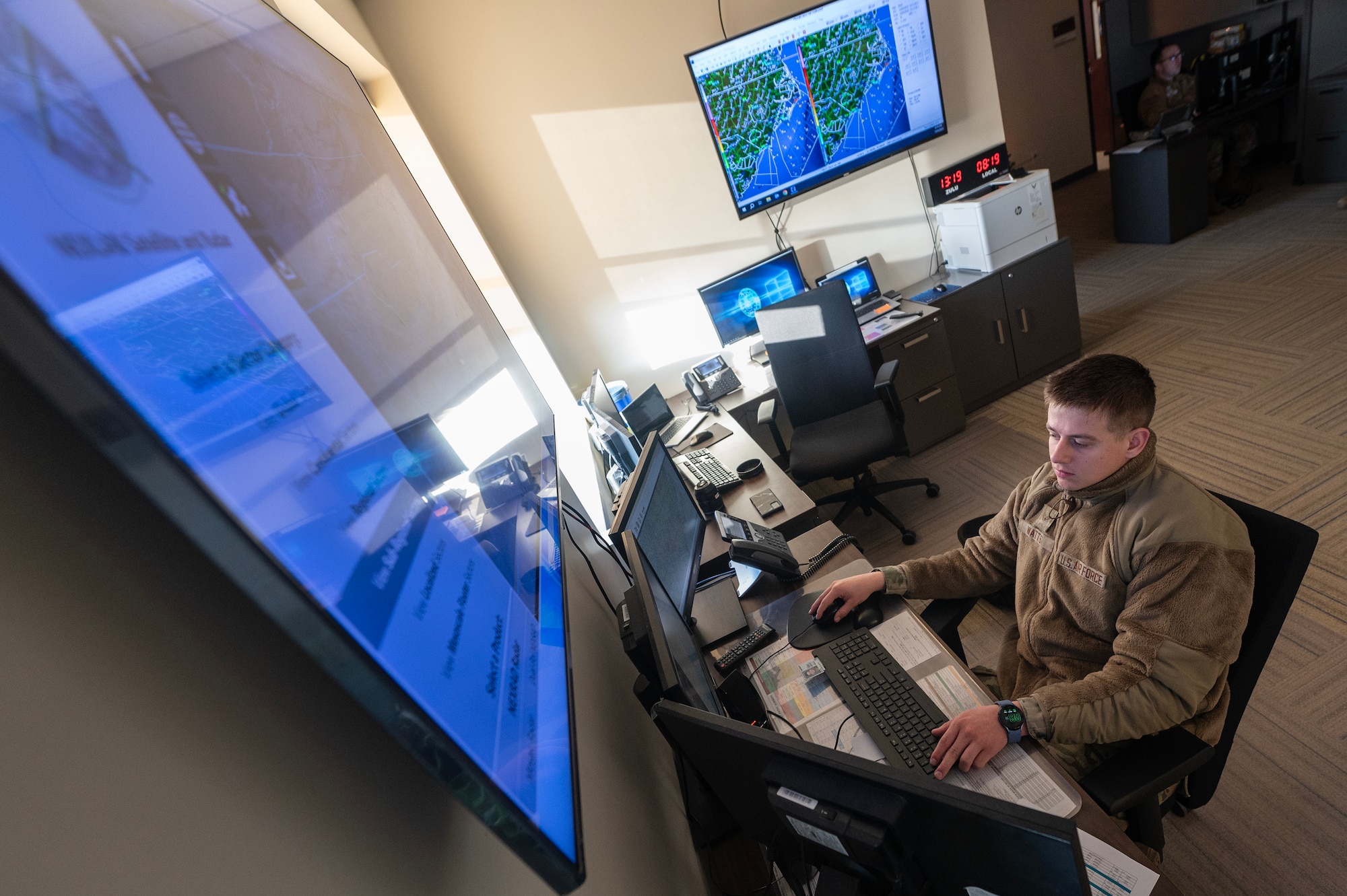 Senior Airman Richard Watts, 4th Operations Support Squadron weather journeyman, analyzes weather data.