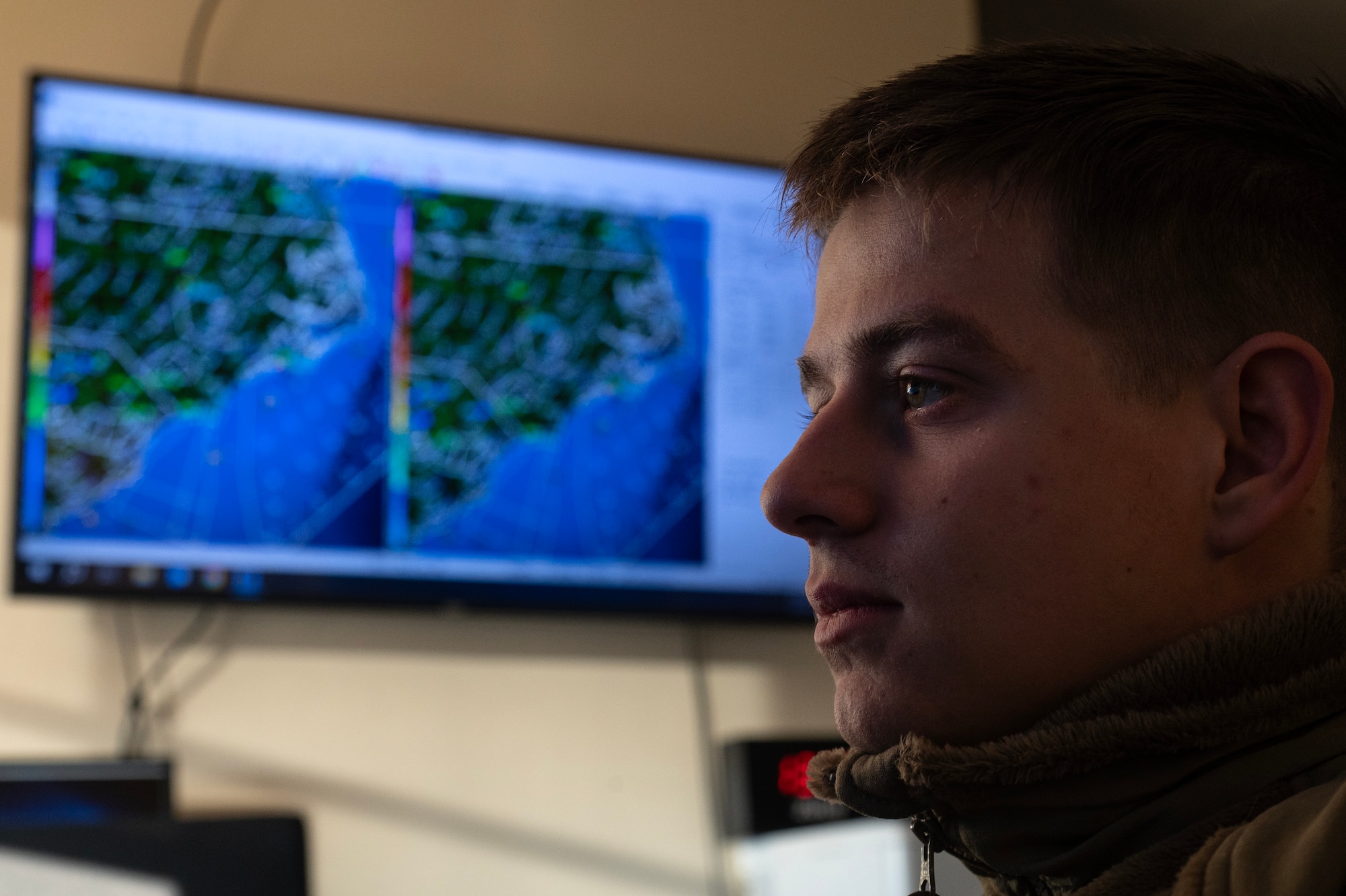 Senior Airman Richard Watts, 4th Operations Support Squadron weather journeyman, analyzes weather data.