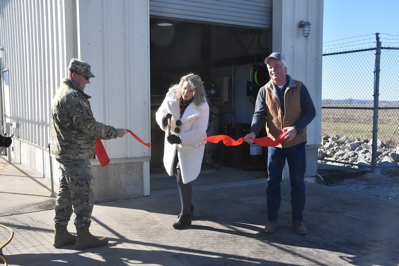 Col. Andy Pannier, St. Louis District commander, Abby Hoyt, project manager, and Mark Gremaud, Bois Brule Levee and Drainage District cutting the ribbon at the Missouri Chute Pump Station near the Mississippi River in Bois Brule Township, Missouri to celebrate the closeout of the Bois Brule Levee rehabilitation project, Dec. 6, 2024. This ribbon-cutting ceremony marks the completion of the project that will provide resilient infrastructure for flood risk reduction within the 26,000 acres of agricultural lands, commercial businesses and homes in the area protected by the levee.