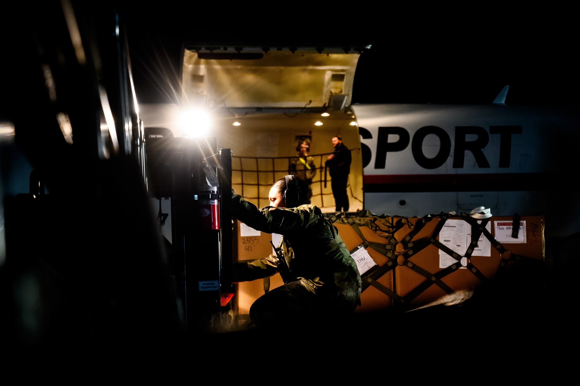 U.S. Air Force Senior Airman Crystal Elliott and Staff Sgt. Garret Brockman, 305th Aerial Port Squadron air transportation specialists, prepare to upload a palette onto a Boeing 757 aircraft at Joint Base McGuire-Dix-Lakehurst, N.J., Nov. 27, 2024. The 305th APS supports a channel mission to Pituffik Space Base in Greenland where essential goods are supplied sustain their mission. (U.S. Air Force photo by Senior Airman Matt Porter)