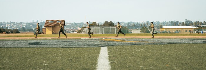 U.S. Marines with Headquarters and Service Battalion, Marine Corps Recruit Depot San Diego, conduct the movement to contact portion of a combat fitness test at MCRD San Diego, California, Dec. 4, 2024. The CFT is an annual fitness test that is required of all Marines to pass and maintain consisting of an 880-yard sprint, ammunition can lifts, and a maneuver under fire drill. (U.S. Marine Corps photo by Cpl. Sarah M. Grawcock)
