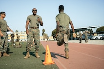 U.S. Marine Corps Training Noncommissioned Officer, Sgt. Alpha Balde, with Headquarters and Service Battalion, Marine Corps Recruit Depot San Diego, monitors the movement to contact portion of a combat fitness test at MCRD San Diego, California, Dec. 4, 2024. The CFT is an annual fitness test that is required of all Marines to pass and maintain consisting of an 880-yard sprint, ammunition can lifts, and a maneuver under fire drill. (U.S. Marine Corps photo by Cpl. Sarah M. Grawcock)
