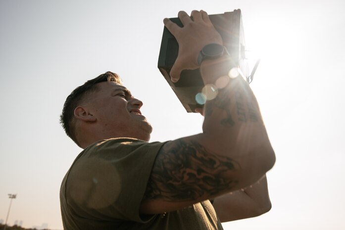 U.S. Marine Corps Operations Chief with Communication Strategy and Operations, Sgt. Jesse Carter-Powell, with Headquarters and Service Battalion, Marine Corps Recruit Depot San Diego, conducts the ammunition can lift portion of a combat fitness test at MCRD San Diego, California, Dec. 4, 2024. The CFT is an annual fitness test that is required of all Marines to pass and maintain consisting of an 880-yard sprint, ammunition can lifts, and a maneuver under fire drill. (U.S. Marine Corps photo by Cpl. Sarah M. Grawcock)
