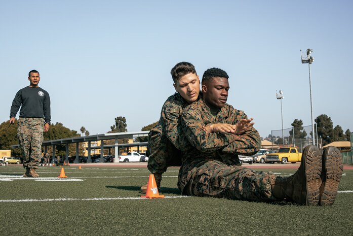 U.S. Marines with Headquarters and Service Battalion, Marine Corps Recruit Depot San Diego, conduct the maneuver under fire portion of a combat fitness test at MCRD San Diego, California, Dec. 4, 2024. The CFT is an annual fitness test that is required of all Marines to pass and maintain consisting of an 880-yard sprint, ammunition can lifts, and a maneuver under fire drill. (U.S. Marine Corps photo by Cpl. Sarah M. Grawcock)