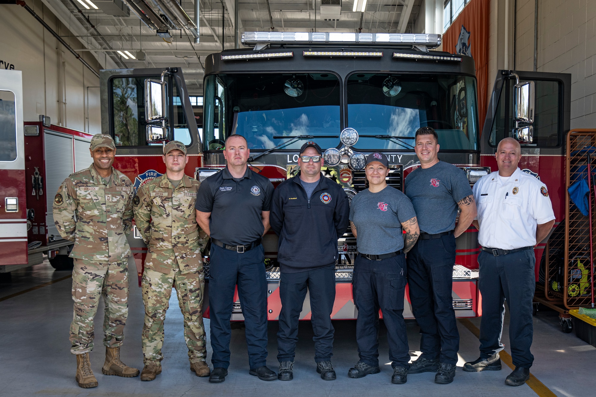 A group of moody and lowndes county fire fighters stand together for a photo