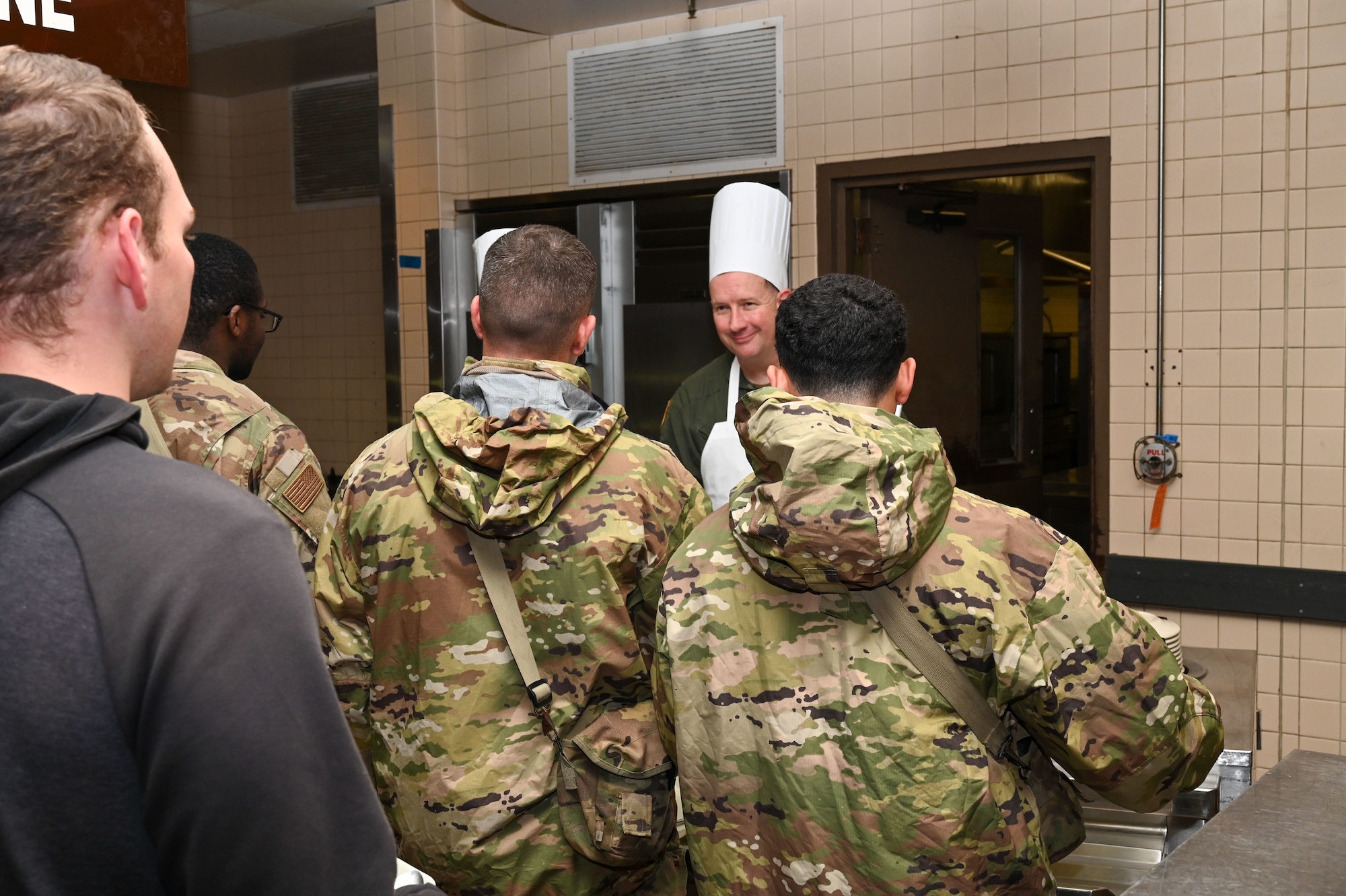 Col. Douglas C. Jeffrey IV 433rd Airlift Wing commander prepares plates of food for service members during the “Feed the Troops” event at the Live Oak Dining Facility on Joint Base San Antonio-Lackland, Texas, Dec. 7, 2024.