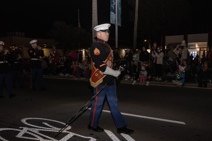 U.S. Marine Corps Drum Major, Sgt. Andrew Wood, with Marine Band San Diego, marches in the Coronado Holiday Parade in Coronado, Dec. 6, 2024. Marine Band San Diego performs a wide variety of music at military ceremonies and civilian events throughout San Diego County and the Western Recruiting Region. (U.S. Marine Corps photo by Cpl. Alexandra M. Earl)