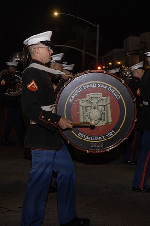 U.S. Marine Corps Musician, Lance Cpl. Jesse Powers, with Marine Band San Diego, marches in the Coronado Holiday Parade in Coronado, Dec. 6, 2024. Marine Band San Diego performs a wide variety of music at military ceremonies and civilian events throughout San Diego County and the Western Recruiting Region. (U.S. Marine Corps photo by Cpl. Alexandra M. Earl)