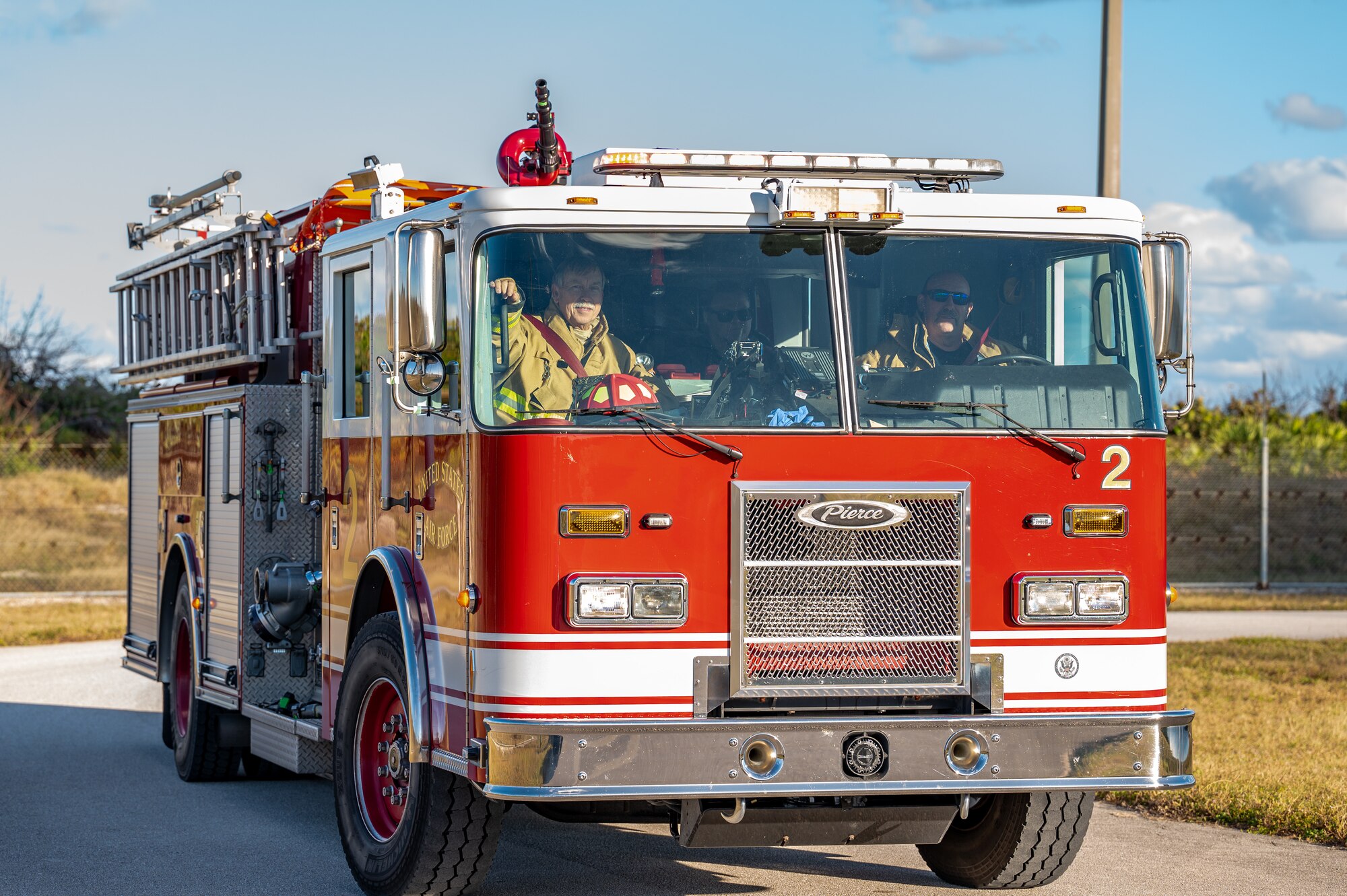 A firetruck sits on a road.