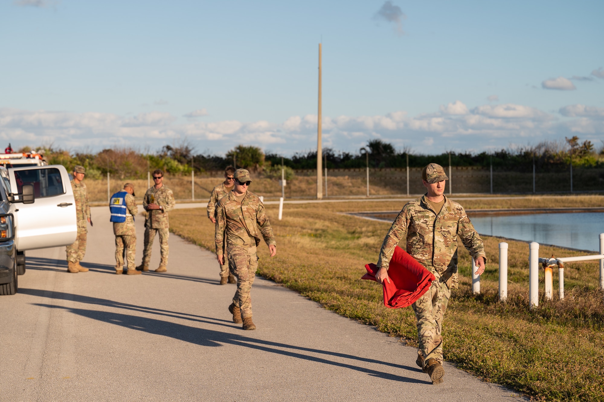 SLD 45 Members walk down a road.