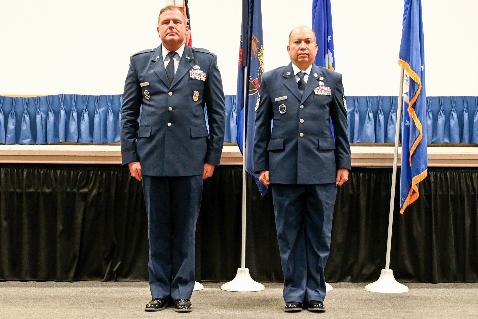 Pennsylvania Air National Guardsmen Lt. Col. Jay Ostrich, left, and Master Sgt. George Roach, stand at attention during Roach's retirement ceremony at Biddle ANG Base Horsham, Pennsylvania, December 7, 2024. Master Sgt. George Roach, 111th Attack Wing Public Affairs Senior Enlisted Leader, received his good-bye salutes and farewell handshakes during the ceremony after a career where he has served for more than 37 years. (U.S. Air national Guard photo by Airman 1st Class Matthew Bergh)