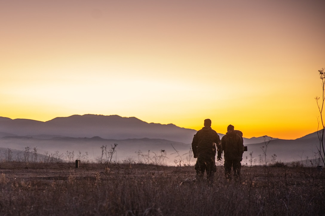 U.S. Marines with Charlie Company, 3rd Light Armored Reconnaissance Battalion, 1st Marine Division, watch the sunrise during Steel Knight 24 at Marine Corps Base Camp Pendleton, California, Dec. 6, 2024. Steel Knight is an annual exercise that takes place in multiple locations across the Southwest that allows I Marine Expeditionary Force to train as a full Marine Air-Ground Task Force and better integrate with joint and naval forces. (U.S. Marine Corps photo by Cpl. Grant Schirmer)