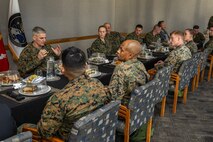 The 37th Assistant Commandant of the Marine Corps, Gen. Christopher J. Mahoney, eats lunch with U.S. Marines assigned to U.S. Space Command’s U.S. Marine Corps Forces Space Command at Peterson Space Force Base, Colo., Feb. 14, 2024. In addition to informational briefings from USSPACECOM senior leaders, the visit underscored the current state of the threats in space and provided insight on the unique contributions of the space domain to the joint warfighter.  USSPACECOM, working with Allies and Partners, plans, executes, and integrates military space power into multi-domain global operations in order to deter aggression, defend national interests and defeat threats when necessary. (USSPACECOM photo by Mass Communication Specialist 1st Class John Philip Wagner Jr.)