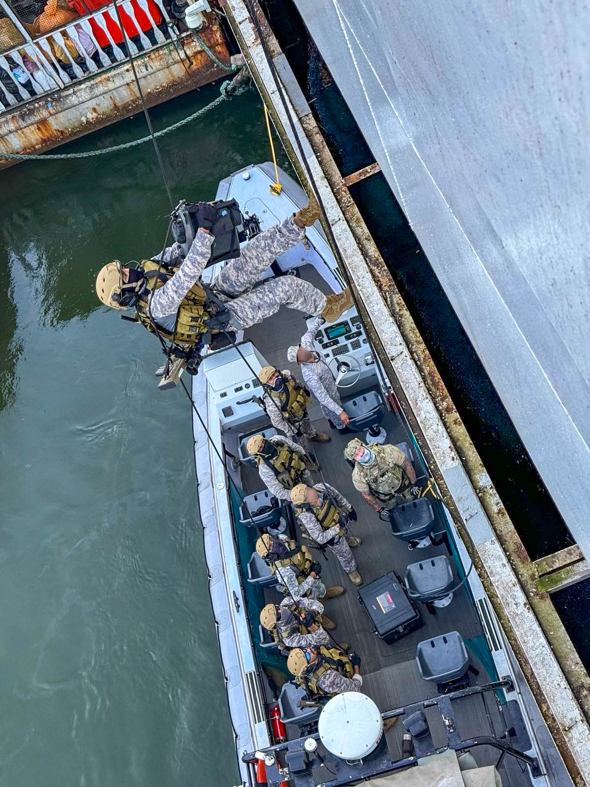 U.S. Naval Special Warfare (NSW) operators and Indian Marine Commando Force (MARCOS) members conduct a simulated visit, board, search and seizure operation during Exercise SANGAM 2024 in Goa, India,