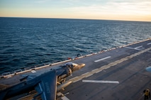 An AV-8B Harrier assigned to Marine Attack Squadron (VMA) 223 takes off on the flight deck of the Wasp-class amphibious assault ship USS Iwo Jima (LHD 7),