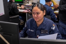 Personnel Specialist 3rd Class Erica Dolor, assigned to the Wasp-class amphibious assault ship USS Iwo Jima (LHD 7), does administrative paperwork in the ship's personnel office