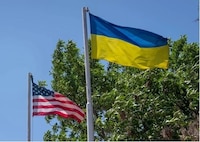 Ukrainian and American flags fly
