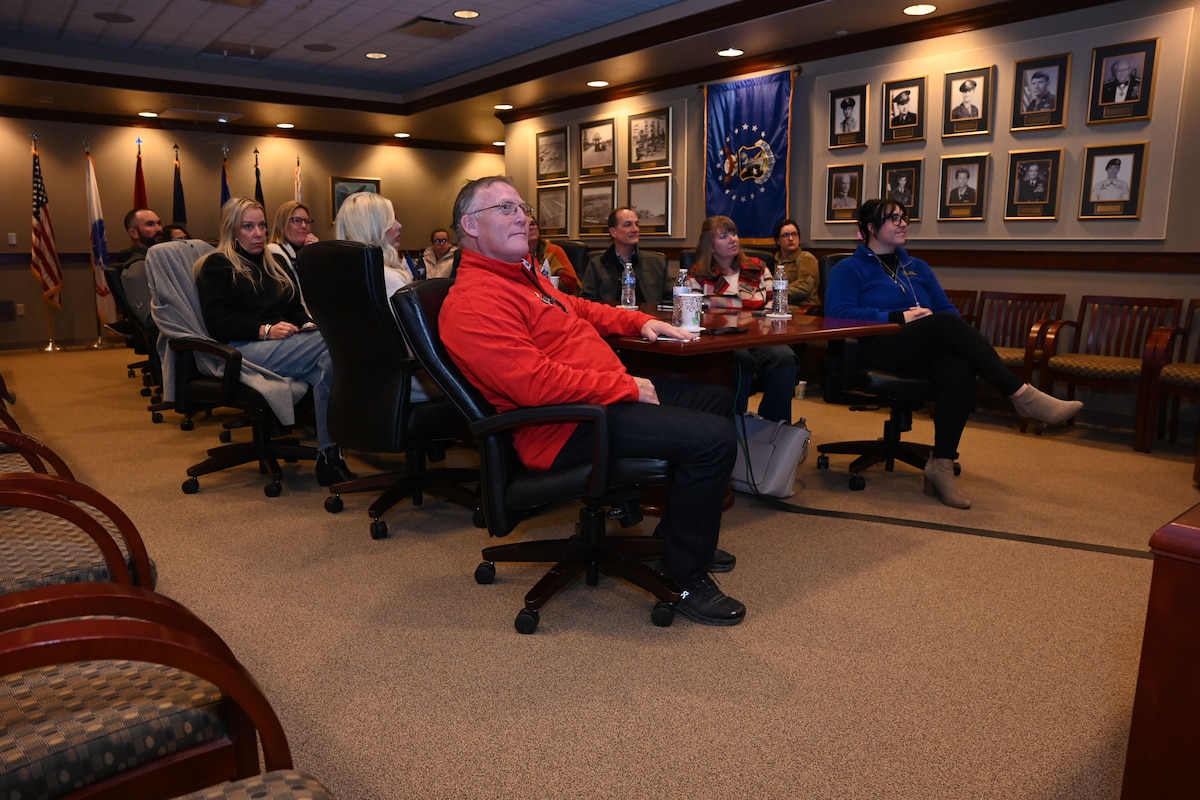 17th Training Wing honorary commanders listen to the 17th Training Wing wing mission brief during the Honorary Commander Immersion at the Norma Brown headquarters building, Goodfellow Air Force Base, Texas, Dec. 6, 2024. The honorary commanders attended the first of five immersions to experience the mission of the 17th TRW. (U.S. Air Force photo by Airman 1st Class Evelyn J. D’Errico)