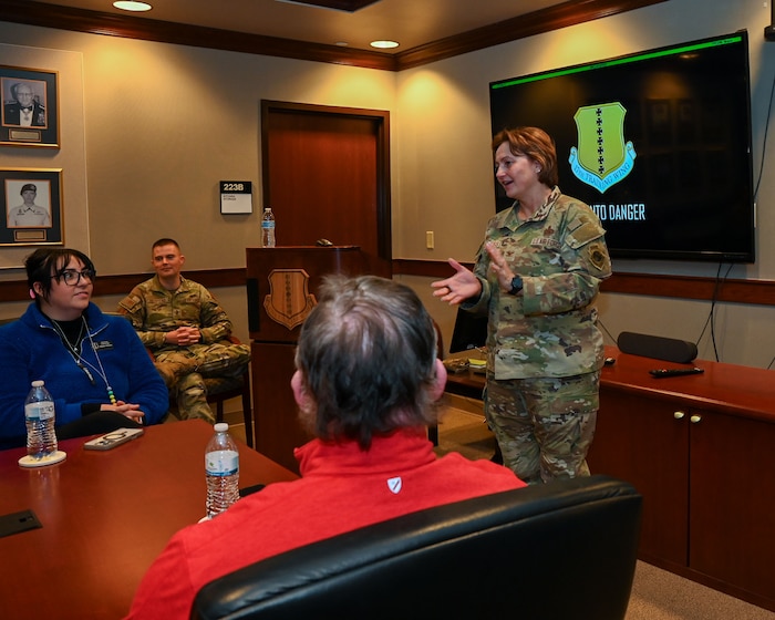 U.S. Air Force Col. Angelina Maguinness, 17th Training Wing commander, briefs the 17th Training Wing honorary commanders on the history of Goodfellow and how community partnerships have benefited both the city and installation at the Norma Brown headquarters building, Goodfellow, Air Force Base, Texas, Dec. 6, 2024. During these immersions, participants are allowed hands-on opportunities to see how the base runs from the lowest to the highest level. (U.S. Air Force photo by Airman 1st Class Evelyn J. D’Errico)