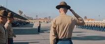 The Company First Sergeant for Kilo Company, 3rd Recruit Training Battalion, U.S. Marine Corps 1st Sgt. Christopher Thomas, center, salutes during a graduation ceremony at Marine Corps Recruit Depot San Diego, California, Dec. 6, 2024. This ceremony marked the end of a 13-week transformation that included training in drill, marksmanship, basic combat skills, and Marine Corps customs and traditions. (U.S. Marine Corps photo by Lance Cpl. Janell B. Alvarez)
