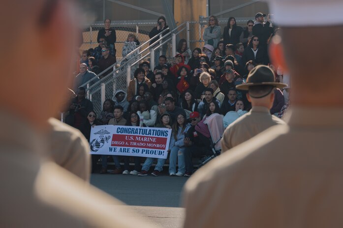 Guests of U.S Marines with Kilo Company, 3rd Recruit Training Battalion, observe a graduation ceremony at Marine Corps Recruit Depot San Diego, California, Dec. 6, 2024. This ceremony marked the end of a 13-week transformation that included training in drill, marksmanship, basic combat skills, and Marine Corps customs and traditions. (U.S. Marine Corps photo by Lance Cpl. Janell B. Alvarez)