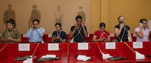 U.S. Marine Corps recruits with India Company, 3rd Recruit Training Battalion, make their scripted phone call home during a receiving event at Marine Corps Recruit Depot San Diego, California, Dec. 2, 2024. During the receiving process, recruits are taken to the United Service Organizations for accountability, checked for contraband, given haircuts, make a scripted phone call home, and issued gear required for training. (U.S. Marine Corps photo by Lance Cpl. Janell B. Alvarez)
