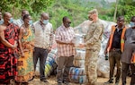 Ghana National Disaster Management Office officials receive supplies from U.S. Embassy personnel
