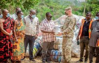 Ghana National Disaster Management Office officials receive supplies from U.S. Embassy personnel