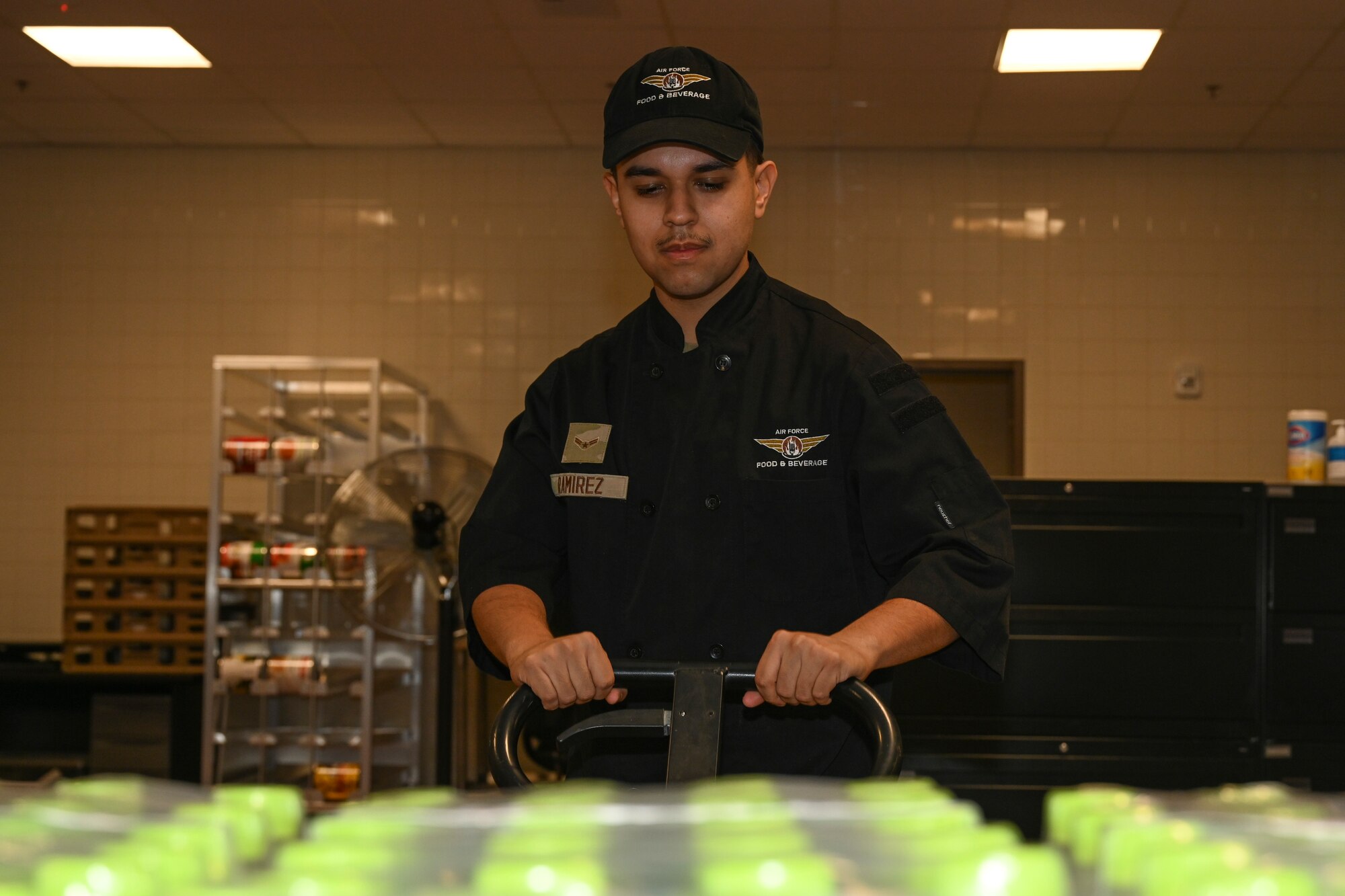 Airman 1st Class Miguel Ramirez, 8th Force Support Squadron food service apprentice, moves inventory in the new dining facility at Kunsan Air Base, Republic of Korea.