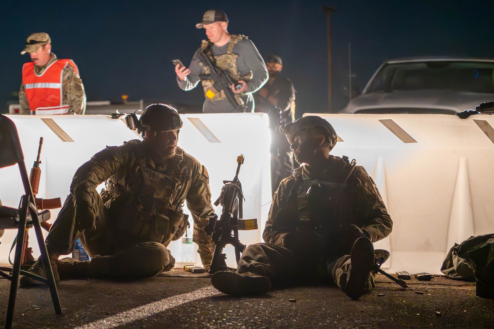 944th Fighter Wing U.S. Air Force Reserve Citizen Airmen collaborate after conducting a Quick Reaction Force response after a simulated attack at Gila Bend Air Force Auxiliary Field near Gila Bend, Ariz., Nov. 15, 2024. Exercise Desert Hammer 25-1 emphasizes the U.S. Air Force Reserve’s commitment to readiness by integrating Agile Combat Support and Large Force Exercise capabilities in a contested environment. (U.S. Air Force photo by Senior Airman Alexis Orozco)