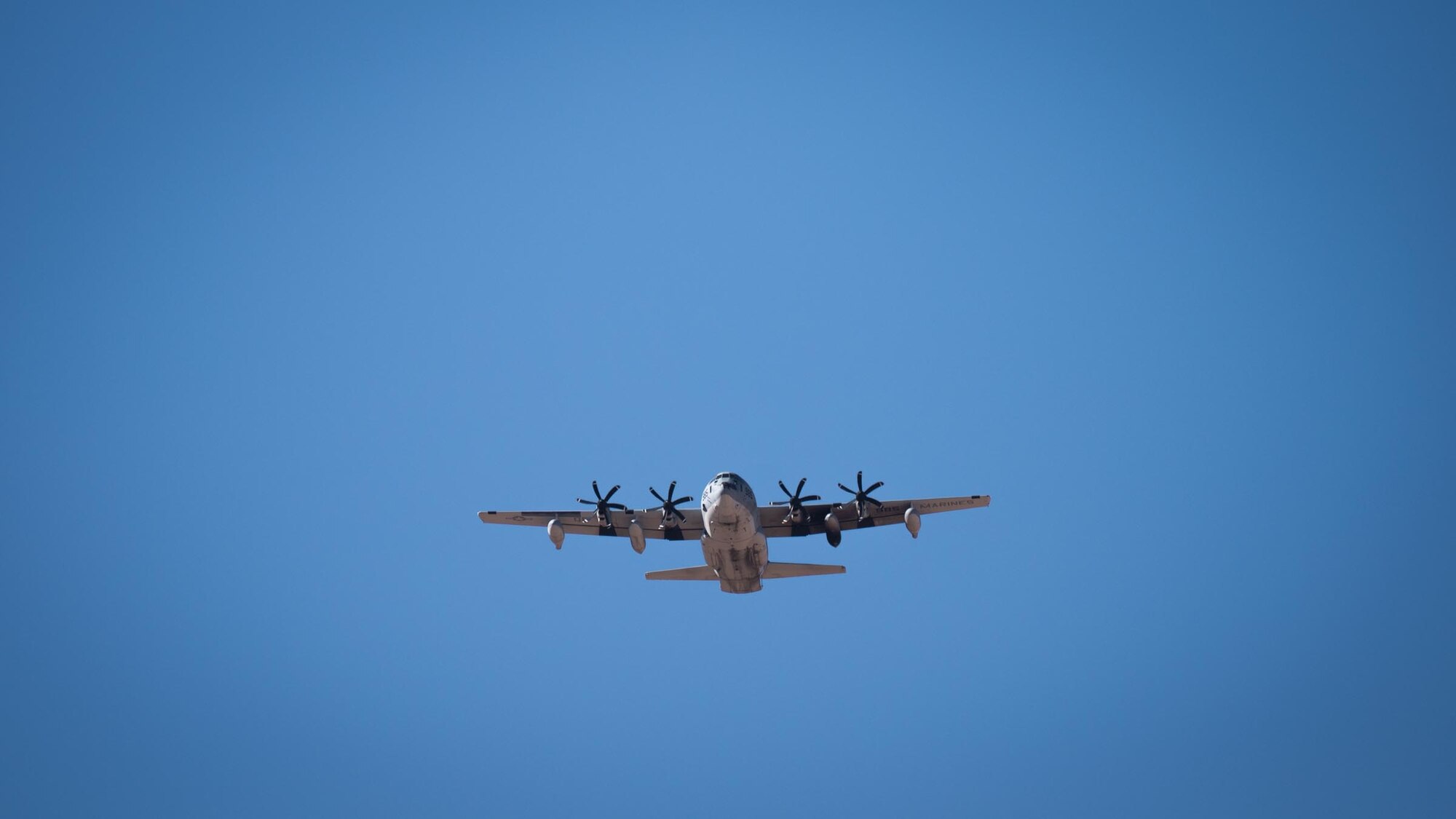 A U.S. Marine Corps KC-130J Hercules approaches a designated drop zone during a training operation as part of Exercise Desert Hammer 25-1 at Auxiliary Airfield 6 near Gila Bend, Ariz., Nov. 15, 2024, following a precision air drop. This large-scale exercise showcases the adaptability of Mission Ready Airmen, advancing the skills needed to thrive in the rapidly evolving challenges of global competition. (U.S. Air Force photo by Senior Airman Jacob Dastas)