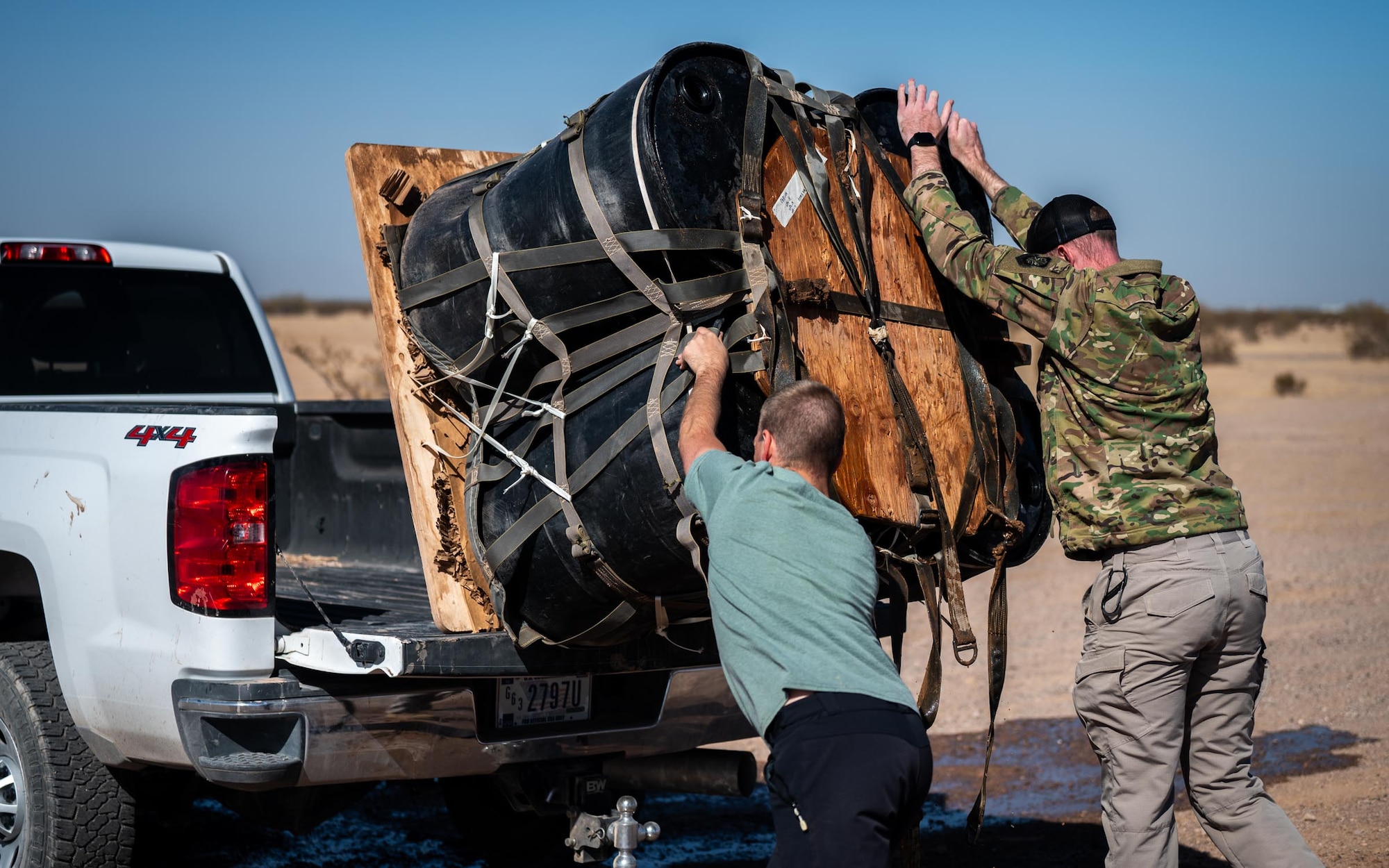 U.S. Air Force Airmen recover an airdropped cargo platform during Exercise Desert Hammer 25-1 at Auxiliary Airfield 6 near Gila Bend, Ariz., Nov. 15, 2024. Set against the unmatched backdrop of the Barry M. Goldwater Range, Desert Hammer leverages Arizona’s strategic geography to provide realistic combat training for U.S. and allied forces. (U.S. Air Force photo by Senior Airman Jacob Dastas)